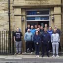 Andy and Rio Powell (centre front) with the team at Healthier Heroes in Burnley