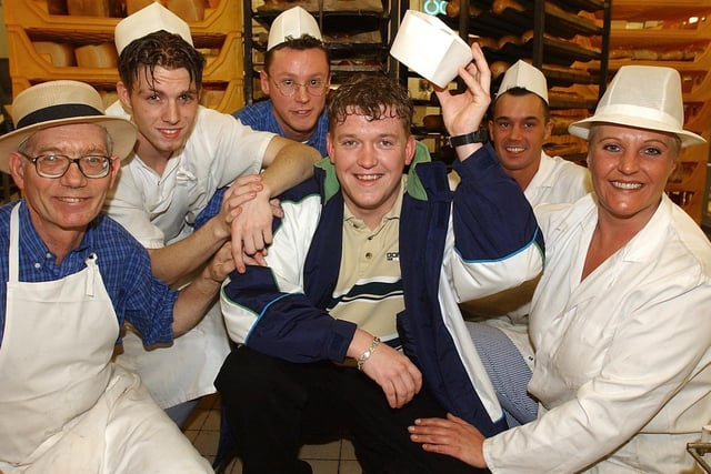 David Russell (centre), a baker at Chorleys Tesco store, picked up a £4,128,013 fortune in February 2002