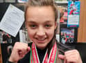 Blessed Trinity RC College pupil Oliwia Kaczmarek has become a kickboxing double world champion