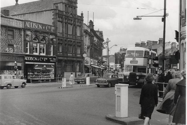This image is taken from the bottom of Manchester Road. On the other side of St James Street, two of Burnley’s famous shops of the past – Dunkerley’s (shoes) and Addison’s (wine) - can be seen, along with a branch of the National Provincial Bank. This latter became part of the National Westminster. On the right, the double decker bus (number 47) is heading for Rosegrove.