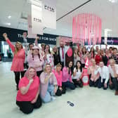 Boundary Outlet Colne staff giving a big BRAvo! for breast cancer charities.