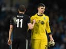 Burnley's New Zealand striker Chris Wood (L) and Burnley's English goalkeeper Nick Pope (R) react at the end of the English FA Cup fourth round football match between Manchester City and Burnley at the Etihad Stadium in Manchester, north west England, on January 26, 2019.