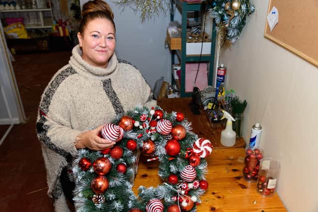 Kathryn Beaver owner of LilyRose Floristry in Burnley pictured creating a Christmas wreath in her new workshop