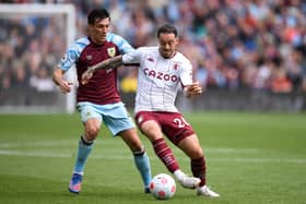 Aston Villa's English striker Danny Ings (R) vies with Burnley's English midfielder Jack Cork (L) during the English Premier League football match between Burnley and Aston Villa at Turf Moor in Burnley, north west England on May 7, 2022.