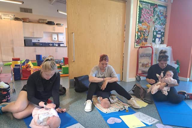 Baby massage is amongst the many activities taking place at some of the new family hubs