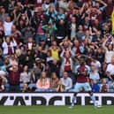 Burnley player Maxwel Cornet and the Burnley fans react after a chance is missed during the Premier League match between Burnley and Arsenal at Turf Moor on September 18, 2021 in Burnley, England. (Photo by Stu Forster/Getty Images)