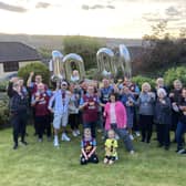 Burnley fan Chris Hogan (front left) with his wife Sam and their family and friends to to celebrate his 1,000th home game