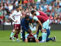 BURNLEY, ENGLAND - MAY 07: James Tarkowski of Burnley receives medical treatment during the Premier League match between Burnley and Aston Villa at Turf Moor on May 07, 2022 in Burnley, England. (Photo by Alex Livesey/Getty Images)