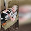 One of the residents at Manor House nursing home in Chatburn with one of the dogs who makes regular visits to the home