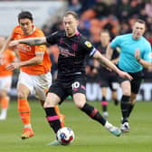 Burnley's Ashley Barnes releases a pass despite the attentions of Blackpool's Kenny Dougall

The EFL Sky Bet Championship - Blackpool v Burnley - Saturday 4th March 2023 - Bloomfield Road - Blackpool
