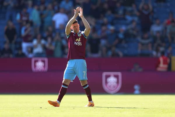 BURNLEY, ENGLAND - MAY 19: Johann Gudmundsson of Burnley applauds the fans as he comes on as a substitute to make his final appearance for Burnley before leaving at the end of the season during the Premier League match between Burnley FC and Nottingham Forest at Turf Moor on May 19, 2024 in Burnley, England. (Photo by Nathan Stirk/Getty Images)