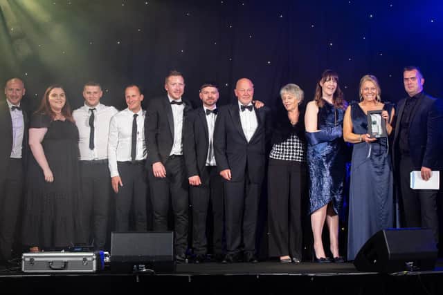 Mantle Packaging staff pictured after receiving the judge's award at the North West Family Business Awards.  left to right Daniel Sieczkowski, Olivia Mantle, Dillan Brooks, Nathan Fraine, Nathan Ball, Daniel Musgrove, Ken Mantle, Christine Mantle, Philippa Mantle-Bowden, Laura Sieczkowski, and a NWFBA judge.