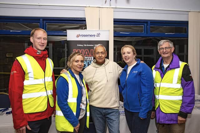 Alan Hutchinson (centre) with, from the left, Rosemere Cancer Foundation’s chief officer Dan Hill, community fundraiser Yvonne Stott and volunteers Louise Grant and John Hodgson after completing the charity’s Walk the Lights from Bispham Tram Stop to Starr Gate.
