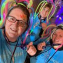 Pictured (left to right) Courtney Leyland, Catherine Mayer and Sam Graham were among 1,500 taking part in the walk in glow in the dark clothes and accessories.
