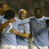 Manchester City's Argentinian player Carlos Tevez (2ndL) celebrates scoring his goal against  Wolverhampton Wanderers with Manchester City's Belgium player Vincent Kompany (L), Manchester City's Stephen Ireland (2nd R) and Manchester City's Micah Richards (R)  during a Premier League match at Molineux Stadium in Wolverhampton, West Midlands, England on December 28, 2009. AFP PHOTO/IAN KINGTON