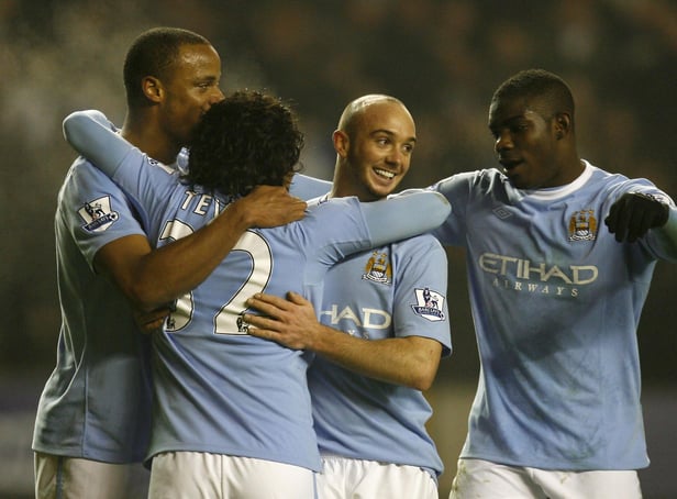 Manchester City's Argentinian player Carlos Tevez (2ndL) celebrates scoring his goal against  Wolverhampton Wanderers with Manchester City's Belgium player Vincent Kompany (L), Manchester City's Stephen Ireland (2nd R) and Manchester City's Micah Richards (R)  during a Premier League match at Molineux Stadium in Wolverhampton, West Midlands, England on December 28, 2009. AFP PHOTO/IAN KINGTON