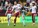 BURNLEY, ENGLAND - MAY 07: Ashley Barnes of Burnley battles for possession with Calum Chambers of Aston Villa during the Premier League match between Burnley and Aston Villa at Turf Moor on May 07, 2022 in Burnley, England. (Photo by Gareth Copley/Getty Images)