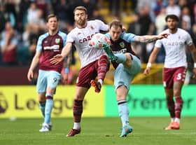 BURNLEY, ENGLAND - MAY 07: Ashley Barnes of Burnley battles for possession with Calum Chambers of Aston Villa during the Premier League match between Burnley and Aston Villa at Turf Moor on May 07, 2022 in Burnley, England. (Photo by Gareth Copley/Getty Images)