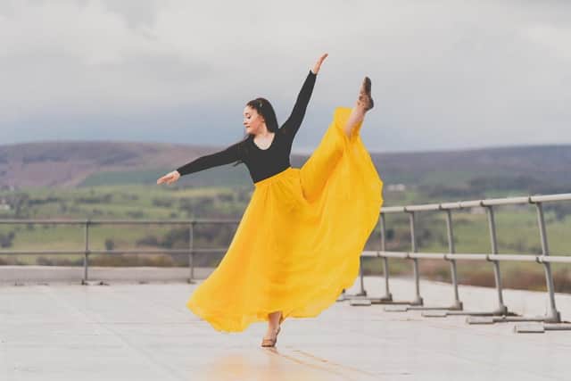 Maisy Anrea dancing on the rooftop of Burnley College