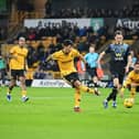 WOLVERHAMPTON, ENGLAND - DECEMBER 05: Hwang Hee-Chan of Wolverhampton Wanderers scores the team's first goal during the Premier League match between Wolverhampton Wanderers and Burnley FC at Molineux on December 05, 2023 in Wolverhampton, England. (Photo by Michael Regan/Getty Images)