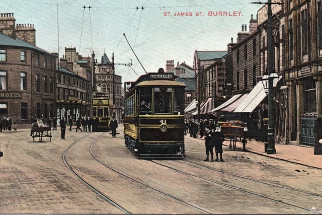 This image is taken on St James Street, near its junction with Manchester Road. A single-decker, on its way to Towneley, is in the foreground, with a double-decker behind. It is difficult to date this image but it must have been taken before 1933, because the Bull Hotel was demolished, in that year, to be replaced by a branch of Burton’s, the men’s outfitters.