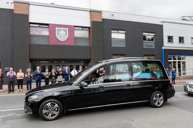 The hearse carrying the coffin of Burnley fan Derek 'Rocky' Mills passes Turf Moor home of his beloved Burnley Football Club. Photo: Kelvin Stuttard