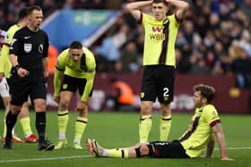 BIRMINGHAM, ENGLAND - DECEMBER 30: Jordan Beyer of Burnley goes down with an injury during the Premier League match between Aston Villa and Burnley FC at Villa Park on December 30, 2023 in Birmingham, England. (Photo by Ryan Pierse/Getty Images)