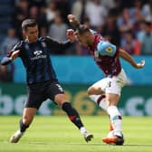 BURNLEY, ENGLAND - AUGUST 06: Josh Brownhill of Burnley FC keeps the ball from Daniel Potts of Luton Town during the Sky Bet Championship match between Burnley and Luton Town at Turf Moor on August 06, 2022 in Burnley, England. (Photo by Ashley Allen/Getty Images)