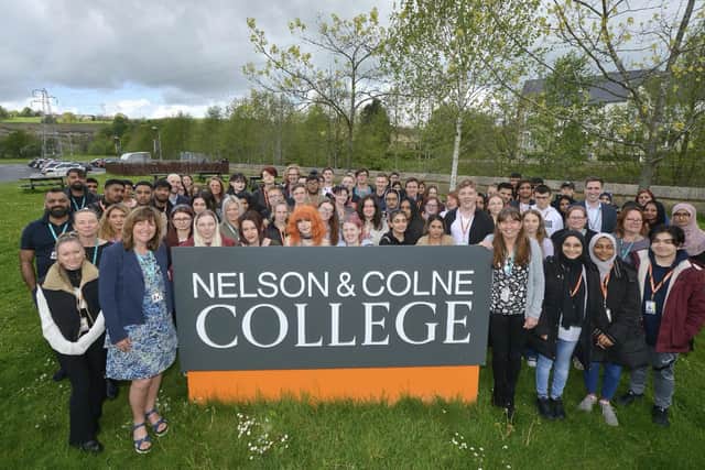 Principal and CEO of Nelson and Colne College Group, Amanda Melton CBE (front left) and Centre Principal of Nelson and Colne College, Fionnuala Swann (front right) celebrate with staff and students