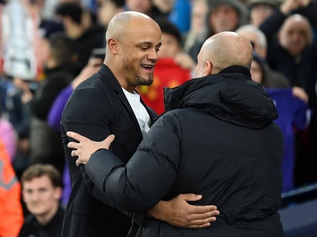 MANCHESTER, ENGLAND - MARCH 18: Vincent Kompany, Manager of Burnley, embraces Pep Guardiola, Manager of Manchester City, prior to the Emirates FA Cup Quarter Final match between Manchester City and Burnley at Etihad Stadium on March 18, 2023 in Manchester, England. (Photo by Michael Regan/Getty Images)
