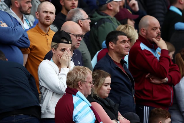 BURNLEY, ENGLAND - MAY 22: Burnley fans react during the Premier League match between Burnley and Newcastle United at Turf Moor on May 22, 2022 in Burnley, England. (Photo by Jan Kruger/Getty Images)