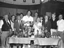 Burnley’s Vince Overson hands over the Ladies Domino Trophy to Plumbe Street Miners Club team captain Joyce Grindle.
Burnley F.C. defender Vince Overson was at Plumbe St. Miners to present the trophies for the Club and Institute Union’s crib, don and dominoes league. More than 170 people were at the club. Club steward Barry Hartley said “Everything went smoothly and it was a great night.”