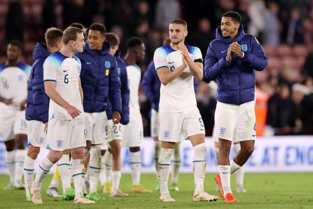 SHEFFIELD, ENGLAND - SEPTEMBER 27: Taylor Harwood-Bellis and Levi Colwill of England applaud fans after the International Friendly match between England U21 and Germany U21 at Bramall Lane on September 27, 2022 in Sheffield, England. (Photo by Naomi Baker/Getty Images)