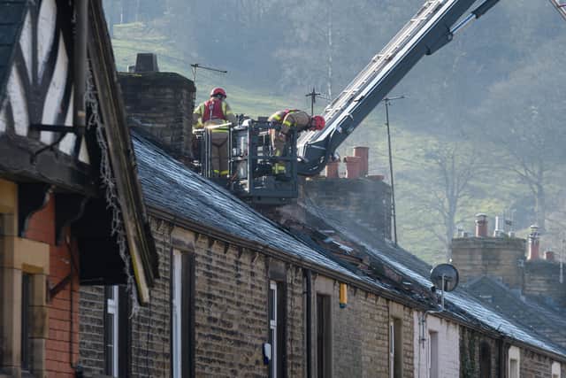 Fire, police and ambulance attend the scene of a house fire on Queen Street, Whalley. Photo: Kelvin Stuttard