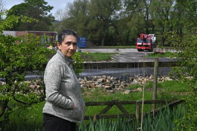 Protestor Dr Sheila Cromie  is pictured in front of the snail farm and holiday lodge site in Ribchester