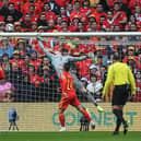 Wales' goalkeeper Wayne Hennessey (C) jumps to deflect the balll during the FIFA World Cup 2022 play-off final qualifier football match between Wales and Ukraine at the Cardiff City Stadium in Cardiff, south Wales, on June 5, 2022. (Photo by Paul ELLIS / AFP) (Photo by PAUL ELLIS/AFP via Getty Images)