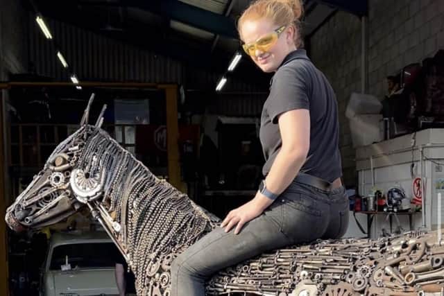 Self taught welder Sarah Francis on Rusty, the full-sized horse she created from junk.