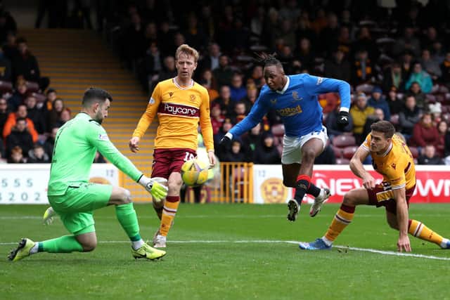 MOTHERWELL, SCOTLAND - OCTOBER 31: Joe Aribo of Rangers shoots whilst under pressure from Liam Kelly of Motherwell during the Cinch Scottish Premiership match between Motherwell FC and Rangers FC at Fir Park on October 31, 2021 in Motherwell, Scotland. (Photo by Ian MacNicol/Getty Images)