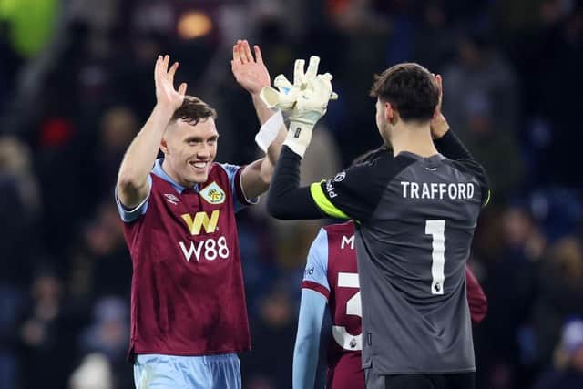 BURNLEY, ENGLAND - DECEMBER 02: Dara O'Shea and James Trafford of Burnley celebrate after the team's victory in the Premier League match between Burnley FC and Sheffield United at Turf Moor on December 02, 2023 in Burnley, England. (Photo by Nathan Stirk/Getty Images)