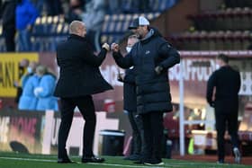 Jurgen Klopp, Manager of Liverpool interacts with Sean Dyche, Manager of Burnley. (Photo by Gareth Copley/Getty Images)