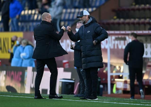 Jurgen Klopp, Manager of Liverpool interacts with Sean Dyche, Manager of Burnley. (Photo by Gareth Copley/Getty Images)