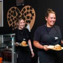 Natalie Stephenson and Libby Stalton-Tracey serve food at the Down Town Kitchen & Cafe in Burnley. Photo: Kelvin Lister-Stuttard