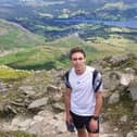 Mason Brewer, who works at Nelson and Colne College, has signed up to take part in a trek to the K2 mountain base camp bordering Pakistan and China in 2025. He is pictured here hiking the Old Man of Coniston as part of his training