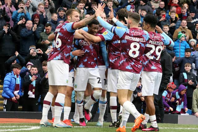 Burnley's Nathan Tella is mobbed by team-mates as he celebrates scoring the opening goal 

The EFL Sky Bet Championship - Burnley v Preston North End - Saturday 11th February 2023 - Turf Moor - Burnley