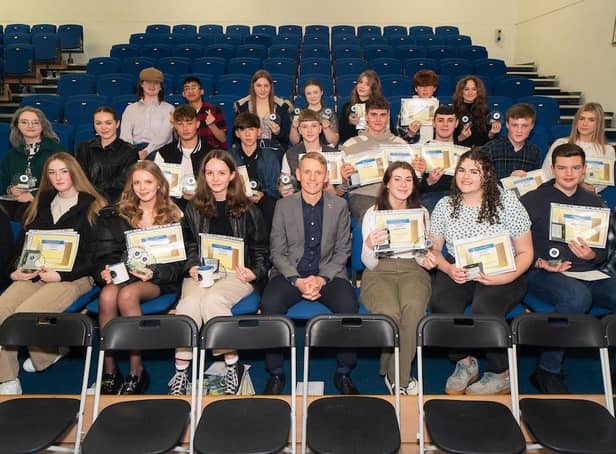 Coun. Scott Cunliffe pictured with some of the former students who returned to Blessed Trinity RC College in Burnley for their GCSE awards night