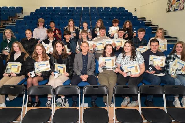 Coun. Scott Cunliffe pictured with some of the former students who returned to Blessed Trinity RC College in Burnley for their GCSE awards night