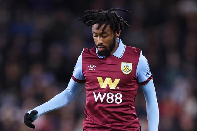 Mike Tresor of Burnley runs with the ball during the Premier League match between Burnley FC and Liverpool FC at Turf Moor on December 26, 2023 in Burnley, England. (Photo by Lewis Storey/Getty Images)