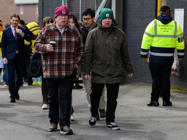 Burnley fans arrive at Turf Moor for the Premier League fixture against Brighton and Hove Albion. Photo: Kelvin Lister-Stuttard