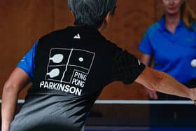 Women play table tennis at the Ping Pong Parkinson initiative in Berlin on April 11, 2023. The World Parkinson's Day takes place on April 11th every year to raise awareness of Parkinson's. The disease is the fastest-growing neurological condition in the world. Being active can help manage Parkinson's symptoms. (Photo by Tobias SCHWARZ / AFP) (Photo by TOBIAS SCHWARZ/AFP via Getty Images)