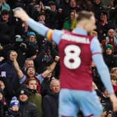 BURNLEY, ENGLAND - DECEMBER 02: Fans of Burnley celebrate after Josh Brownhill scores the teams fifth goal during the Premier League match between Burnley FC and Sheffield United at Turf Moor on December 02, 2023 in Burnley, England. (Photo by Matt McNulty/Getty Images)
